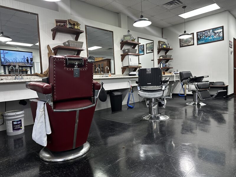 The red vintage chair up front, mirrors running the length of the wall.